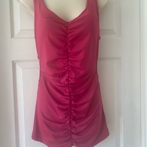 Super sexy cut out top. Strappy in back. Non removable pads. Slinky soft.